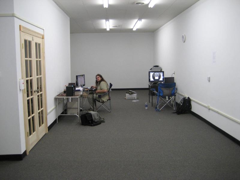 nick sitting at his drywall lane desk before office was furnished