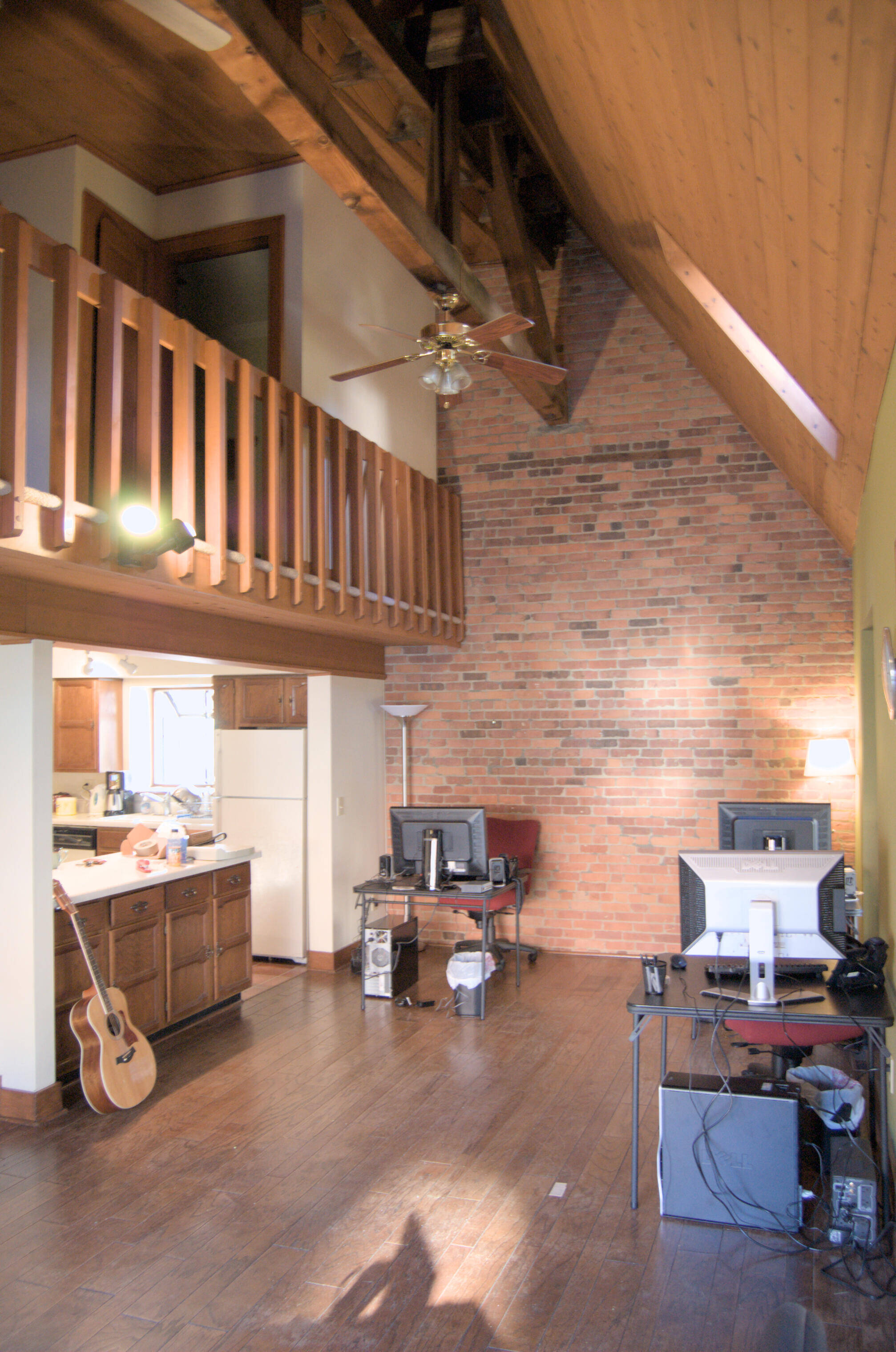 willett house loft, desk and kitchen with vaulted ceiling